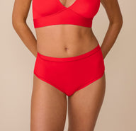 Front view of Freya wearing the Bliss Highwaist Brief in Cherry. The image highlights the brief’s high-rise fit and smooth microfiber fabric that offers a soft, barely-there feel. sizing: Freya wears size Small