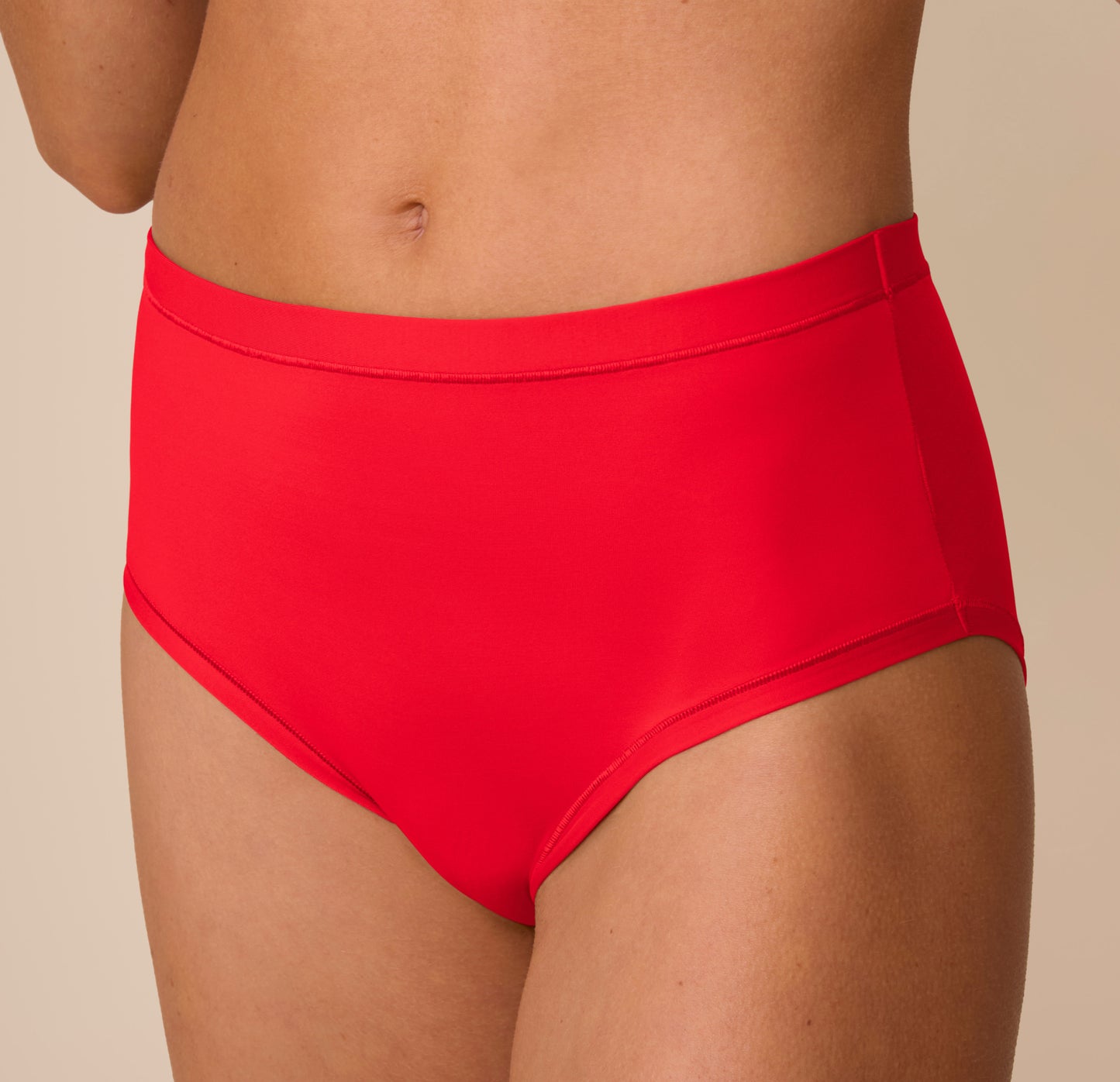 Close-up side view of Freya in the Bliss Highwaist Brief in Cherry. The image focuses on the curve-hugging fit and the soft, flexible waistband.