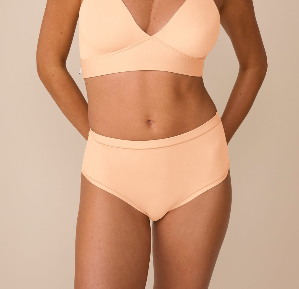 Front view of Freya wearing the Bliss Highwaist Brief in Daybreak. The image highlights the smooth, full-coverage fit and high-rise waistband. sizing: Freya wears size Small