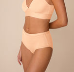 Three quarter angle of Freya in the Bliss Highwaist Brief in Daybreak, emphasizing the stretchy microfiber fabric and clean edges.