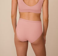 Back view of Freya in the Bliss Highwaist Brief in Dusty Rose, showing the smooth, full-coverage fit and wide waistband.