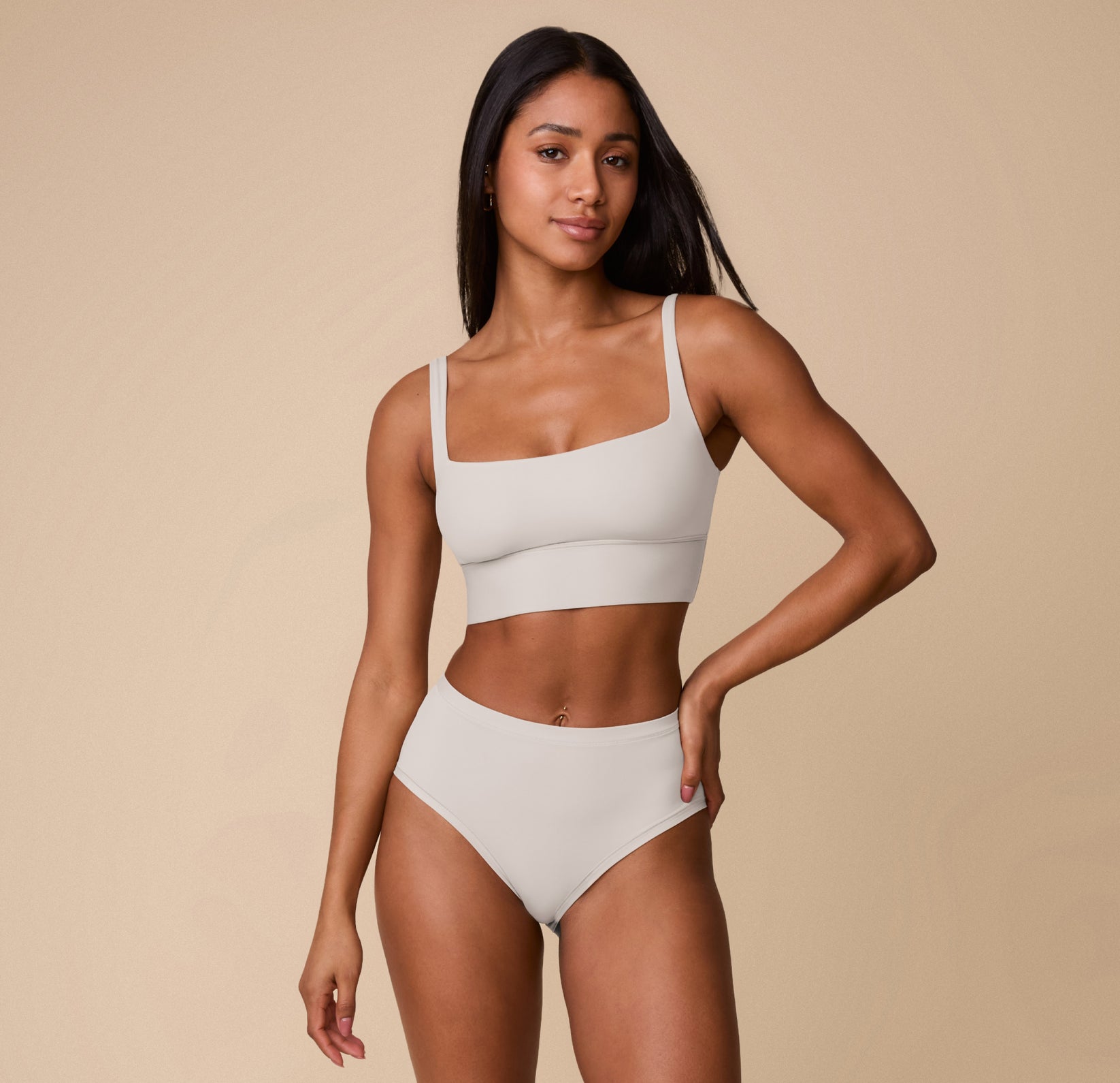 Full-body shot of Ally wearing the Bliss Highwaist Brief and coordinating Bliss Square Neck Bralette in Frost. The set highlights the minimal, elevated design and barely-there feel.