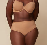 Akesha wearing the Bliss Highwaist Brief and Base T-Shirt Bra in Tan. The high rise waistband and microfiber material are emphasized. sizing: Akesha wears size XL