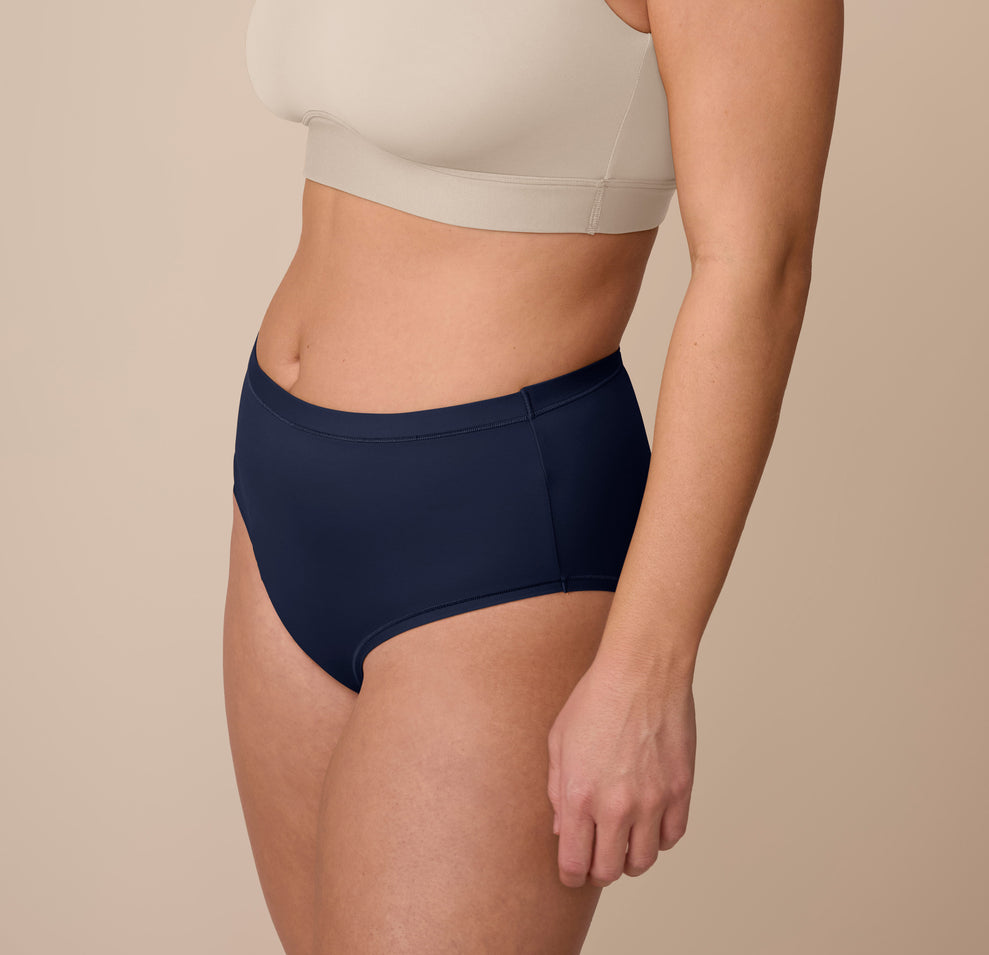 Three quarter angle of the Bliss Highwaist Brief in True Blue on Sonnie, showing the silky microfiber fabric and gentle waistband.