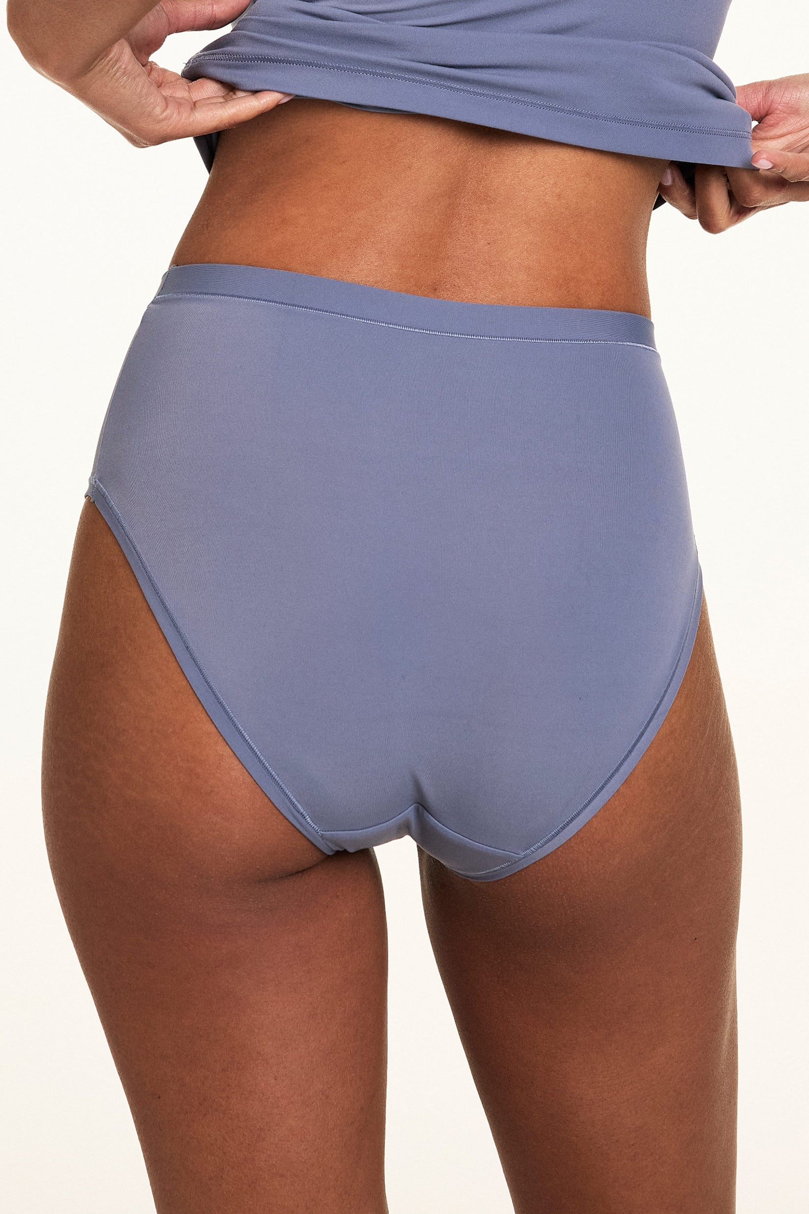 Close-up back view of the Bliss Highwaist Brief in Steel paired with a matching Steel tank, showing the smooth microfiber fabric and high-rise fit.