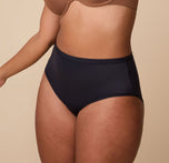 India modeling the Bliss Highwaist Brief from a three-quarter angle, highlighting the flattering high-rise silhouette and soft, smoothing fabric.