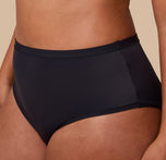 A zoomed-in shot of the Bliss Highwaist Brief, showing the fabric texture and precise stitching along the waistband and leg openings.