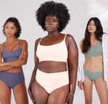 Akesha, Ally, and Anna stand together with Akesha in the middle highlighting the Bliss Highwaist Brief in Quartz. All three models wear matching colored sets in Overcast, Quartz, and Seaglass. 