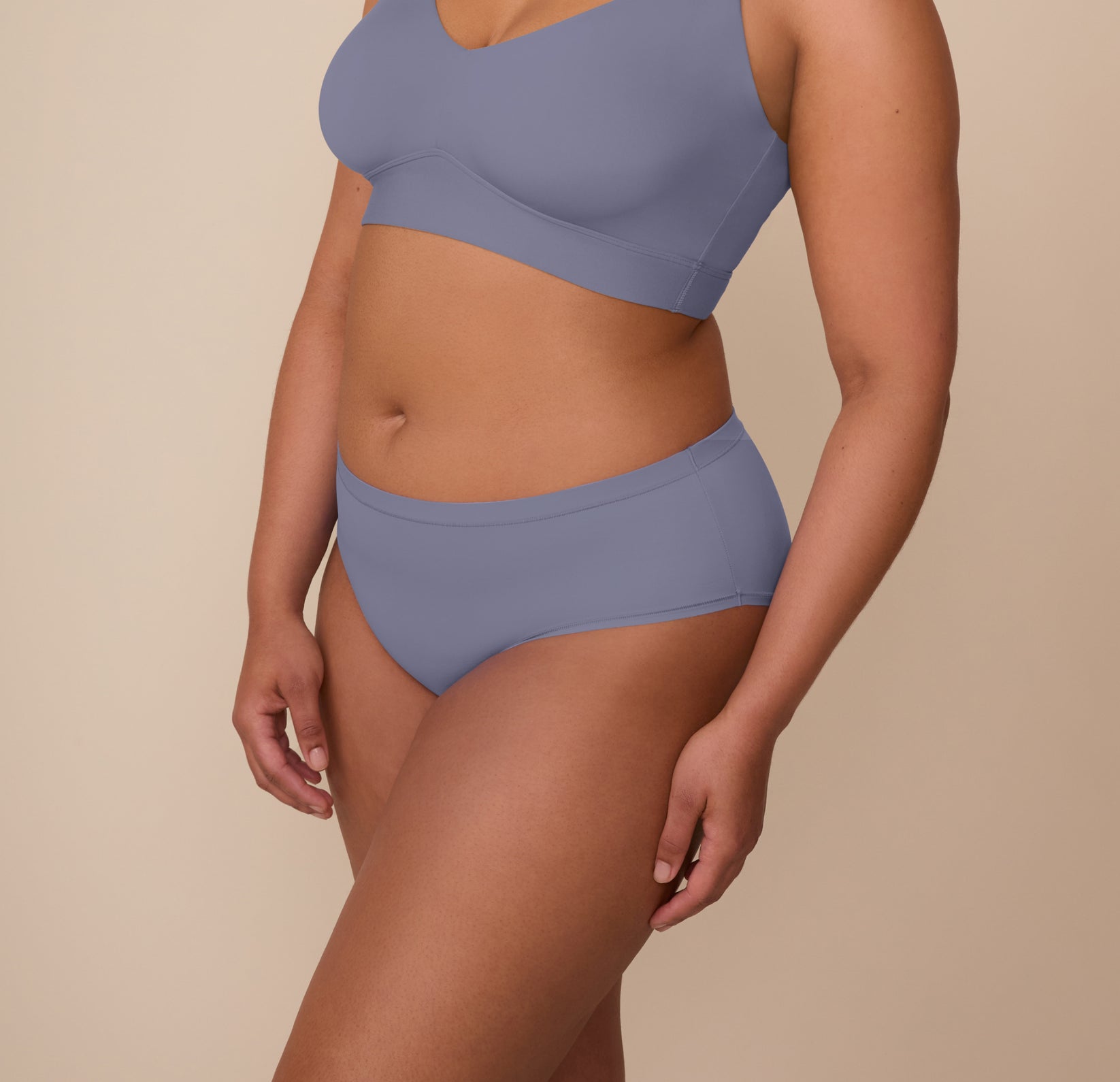 Side angle of Zarria in the Bliss Hiphugger in Steel, showing the mid-rise fit and clean bonded seams designed for invisible comfort.