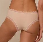 Close-up back angled view of Marcela in the Bliss Lace Cheeky Brief in Beige. The image focuses on the soft, flexible lace and minimal back coverage designed for everyday comfort.