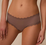 Close-up front angled view of Marcela wearing the Bliss Lace Cheeky Brief in Mauve, showing the smooth microfiber fabric and lace trim with a focus on comfort and everyday wearability.