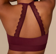 Detailed shot of the back lace halter straps on the Bliss Lace Halterneck Bralette in Bordeaux, showing the scalloped edge and stretch comfort.