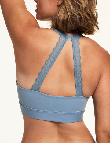 Back view of Sonnie wearing the Bliss Lace Halterneck Bralette in Poolside with matching Poolside underwear, highlighting the lace halter straps and smooth microfiber band.  sizing: Sonnie wears size Large