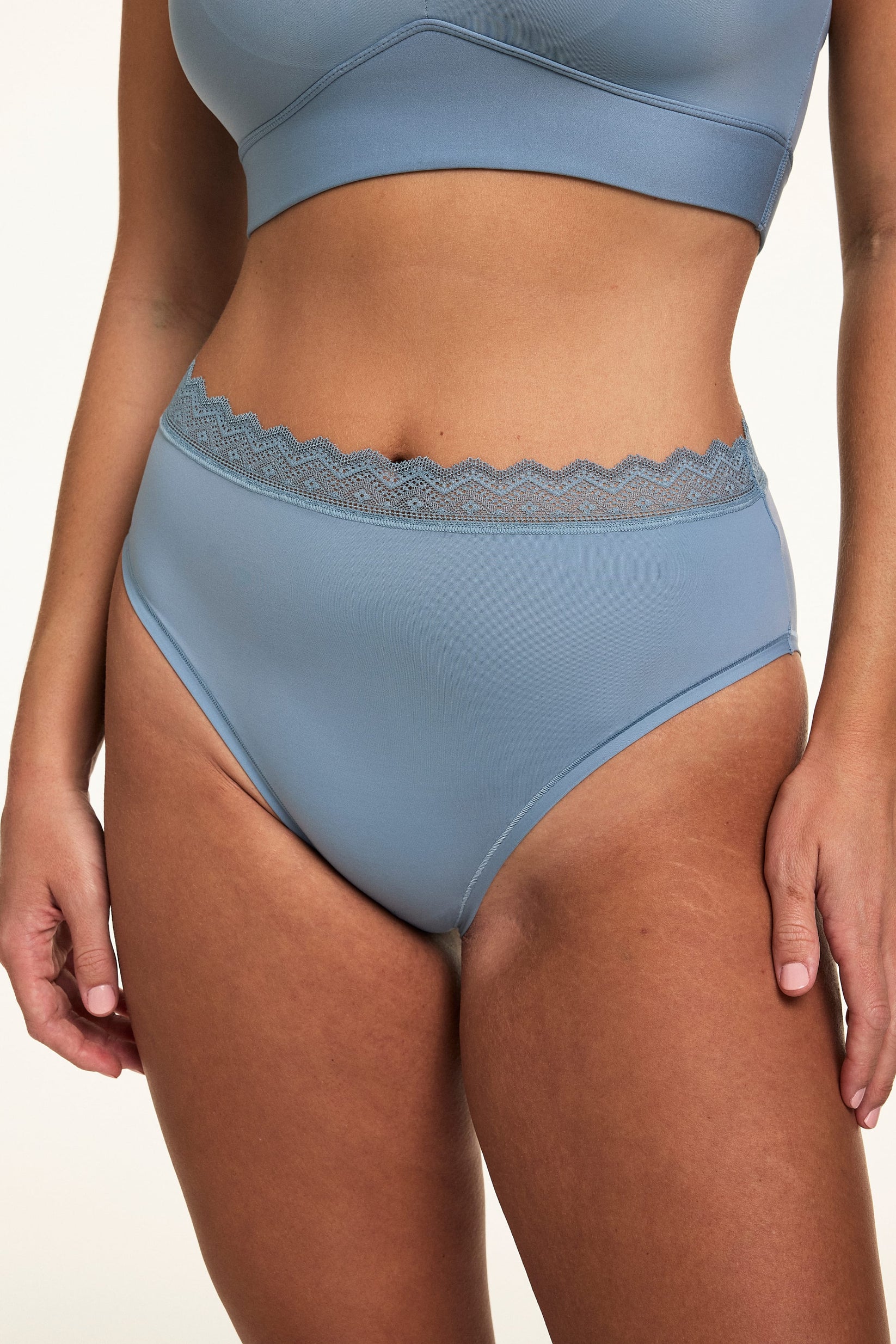 Close-up of the Bliss Lace Highwaist in Poolside paired with a matching Poolside bralette, highlighting the high-rise fit, smooth microfiber fabric, and soft lace trim. sizing: Sonnie wears size Large