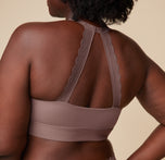 Close-up back view of Akesha wearing the Bliss Lace Halterneck Bralette in Mauve. The image focuses on the detailed lace halterneck strap, offering a stylish and supportive look. sizing: Akesha wears size Large. Sizes L-4XL have higher center in front for additional support.