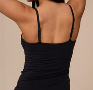 Back view of Marcela in the Bliss Cami in Black. The image highlights the thin adjustable straps and smooth back fit.