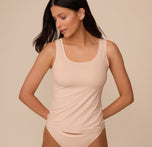 Front view of Marcela wearing the Bliss Tank in Beige. The tank features a wide scoop neckline and thick shoulder straps, offering a smooth, body-hugging fit. sizing: Marcela wears size XS