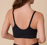 A back view of Gracie wearing the Bliss Nursing Bra in Black, showcasing the scoop-back design and stretchy construction for ultimate comfort.