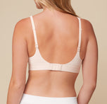 Back view of Megan wearing the Bliss Plunge Adjustable Bralette in Rose, displaying the standard strap configuration.