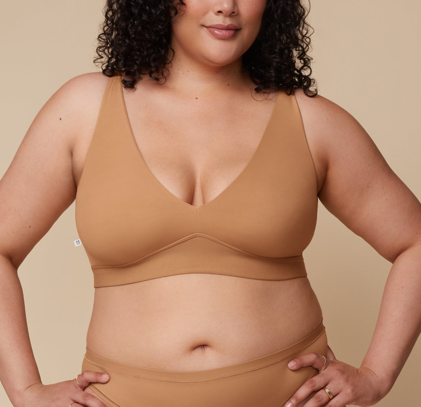 Bianca in the Bliss Plunge Adjustable Bralette and Bliss Thong, standing forward with a relaxed stance. sizing: Bianca wears size XL