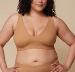 Bianca in the Bliss Plunge Adjustable Bralette and Bliss Thong, standing forward with a relaxed stance. sizing: Bianca wears size XL