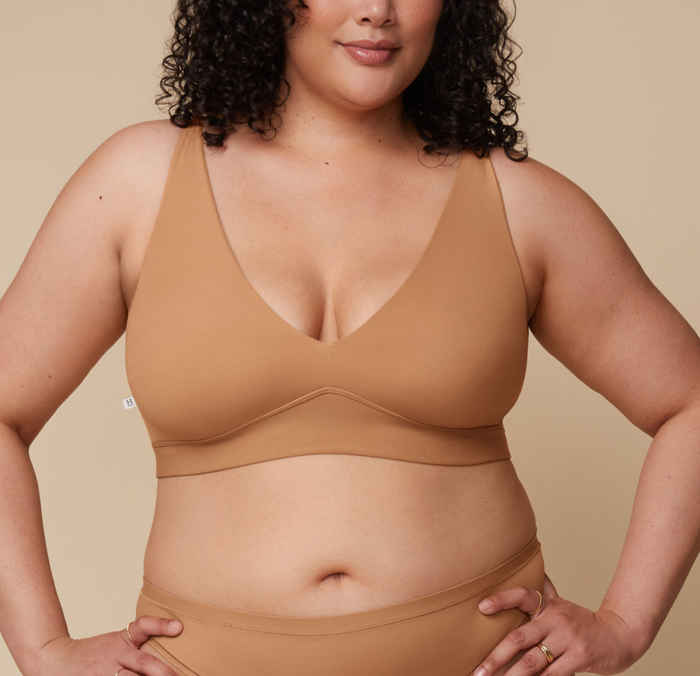 Bianca in the Bliss Plunge Adjustable Bralette and Bliss Thong, standing forward with a relaxed stance. sizing: Bianca wears size XL