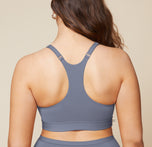A back view of Summerlyn wearing the Bliss Racerback Bralette in Steel and the Bliss Boyshort in Steel. The image highlights the racerback design of the bralette and the full coverage provided by the boyshort.