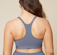 A back view of Summerlyn wearing the Bliss Racerback Bralette in Steel and the Bliss Boyshort in Steel. The image highlights the racerback design of the bralette and the full coverage provided by the boyshort.