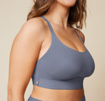 A close-up side view of the Bliss Racerback Bralette in Steel, worn by Summerlyn. The image focuses on the soft fabric and the comfortable fit of the bralette.