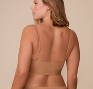 Back view of Sonnie in the Bliss Scoop Bralette in Tan, highlighting the streamlined design and barely-there back coverage.