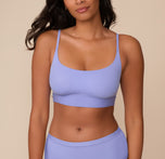Close-up of Victoria wearing the Bliss Scoop Bralette in Dusk. The image highlights the bralette's scoop neckline, adjustable straps, and smooth fit. sizing: Victoria wears size Medium