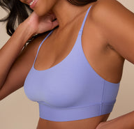 Side angle of Victoria wearing the Bliss Scoop Bralette in Dusk, showing the flattering scoop shape and how it lays smoothly against the body.