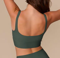Back view of the Bliss Square Neck Bralette in Fir on Alexis, highlighting the smooth, minimal seam band and supportive fit.