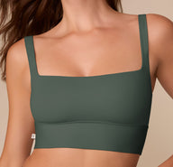 Detail shot of the Bliss Square Neck Bralette in Fir on Alexis, focusing on the clean neckline and minimal seams.