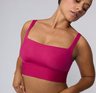 Close-up on a white studio backdrop of the Bliss Square Neck Bralette in Winterberry, highlighting the square neckline, smooth microfiber fabric, and wide shoulder straps. sizing: India wears size Large