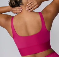 Back view on a white studio backdrop of the Bliss Square Neck Bralette in Winterberry, featuring the scoop back, wide straps, and smooth supportive band.