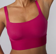 Close-up on a white studio backdrop of the Bliss Square Neck Bralette in Winterberry, focusing on the square neckline, wide straps, and soft microfiber texture.