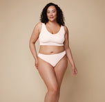 Bianca faces forward wearing the Bliss Bralette and Bliss Thong in Quartz.