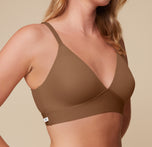 Close-up side angle of Megan in the Bliss Triangle Bralette in Brown. The molded cups and wide band are visible, showcasing the seamless support and soft stretch fabric ideal for everyday wear.