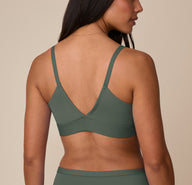 Back view of Nemesis in the Bliss Triangle Bralette in Fir, showing deep V-back and smooth band.