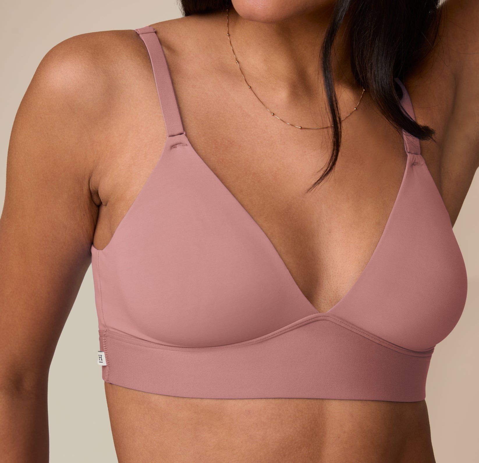 Close-up of Marcela in the Bliss Triangle Bralette in Plum, focusing on the plunging neckline and smooth microfiber finish.
