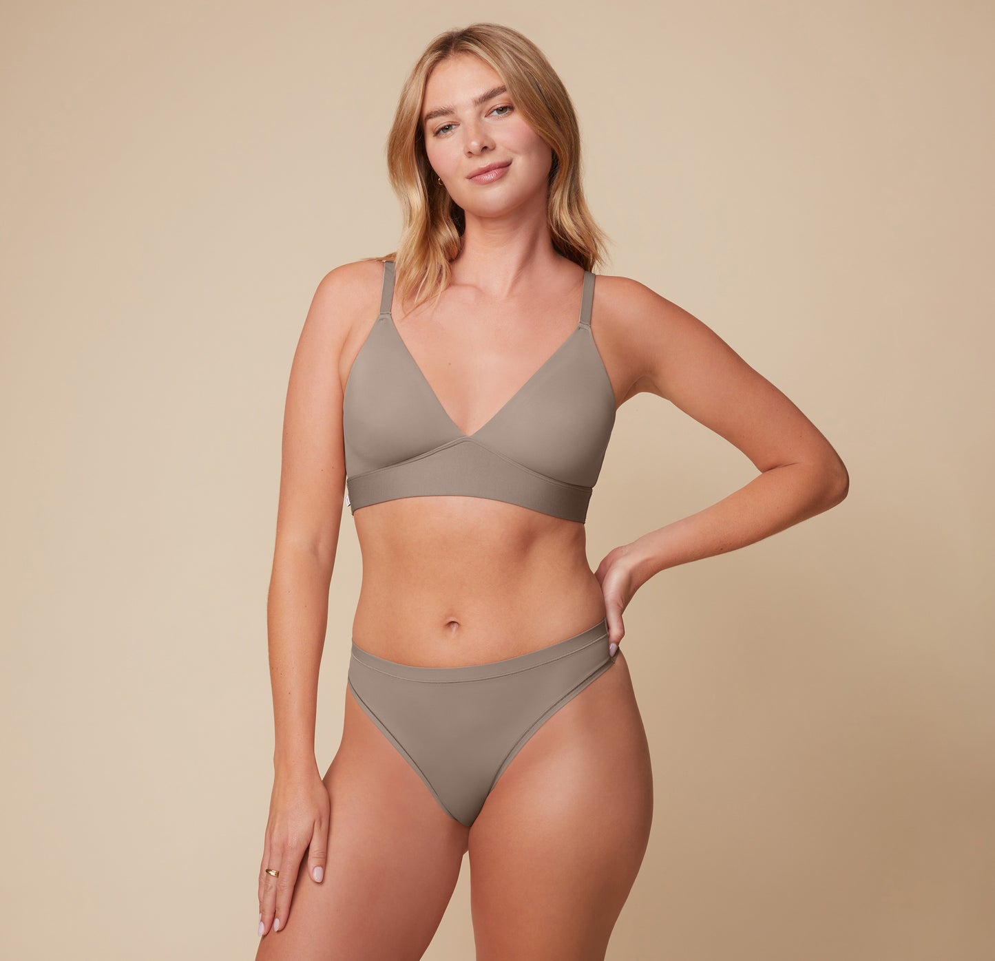 sizing: Megan wears size Medium. Sizes L-6XL have higher center in front for additional support.