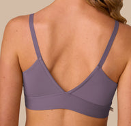 Back close-up of the Bliss Triangle Bralette in Eclipse worn by Freya. The image focuses on the deep V-back construction and clean stitching, offering a smooth finish against the skin.