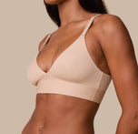 A close-up of Ally in the Bliss Triangle Bralette in Beige, focusing on the front adjusting straps, silky-smooth fabric and soft, supportive underband.