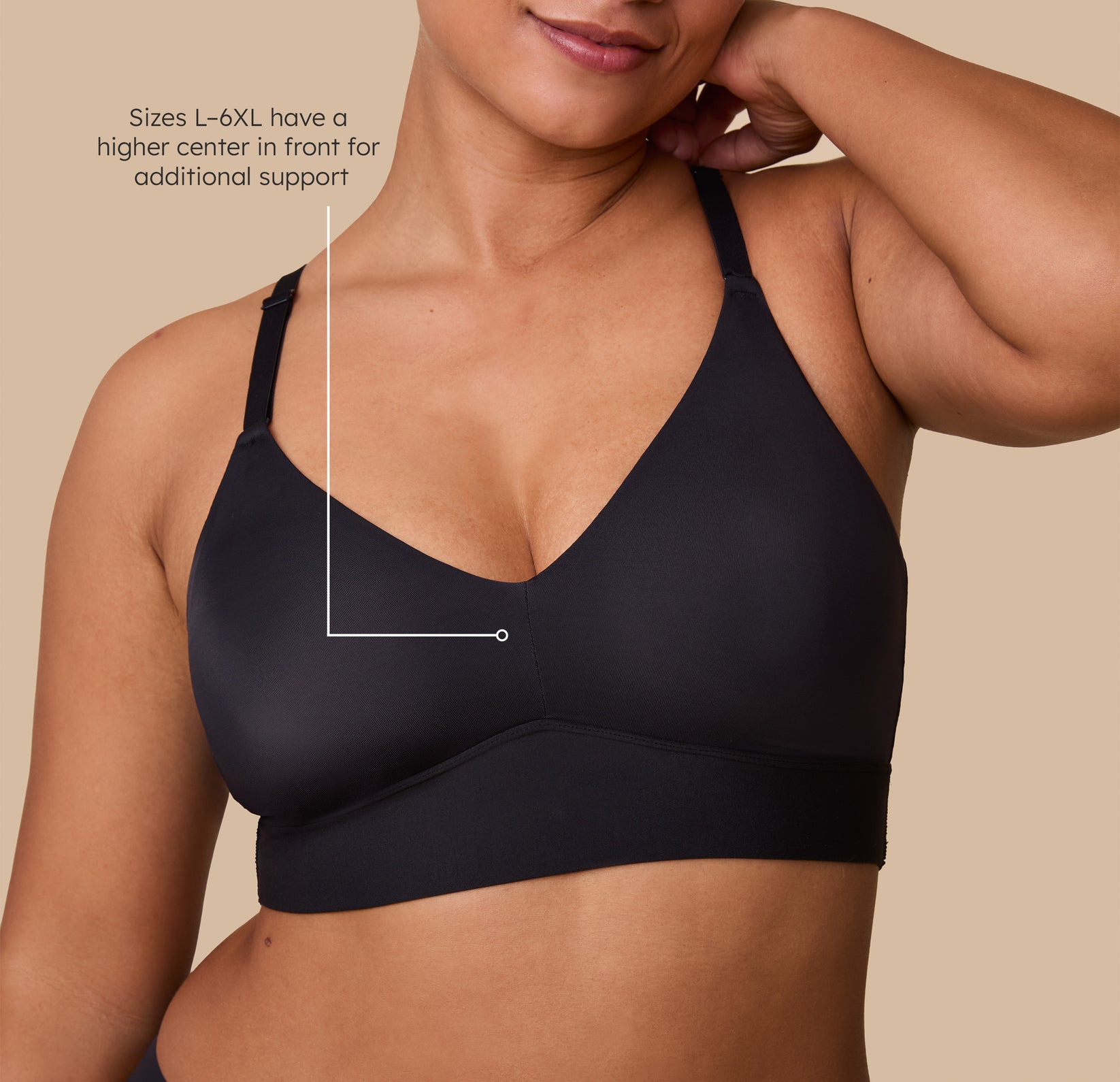 Close up shot of India in the Bliss Triangle in Black. The tagline reads "Sizes L-6XL have a higher center in front for additional support". sizing: India wears size Large