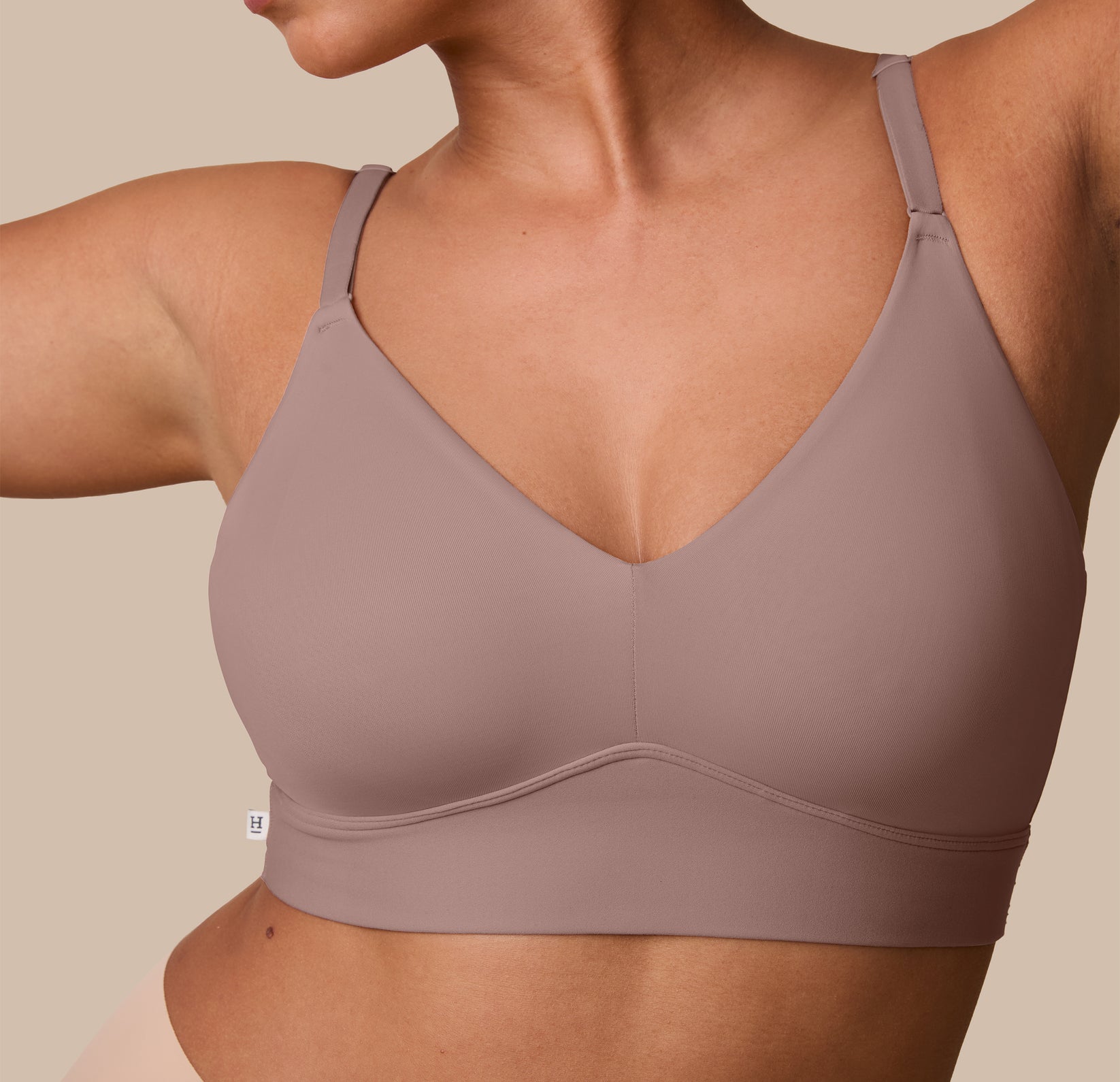 A close-up of the Bliss Triangle Bralette in Mauve on India, showing the soft molded cups and wide underband that offers subtle support without wires.