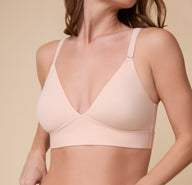  A close-up of the Bliss Triangle Bralette in Rose, focusing on the ultra-soft fabric and sleek, no-padding construction.