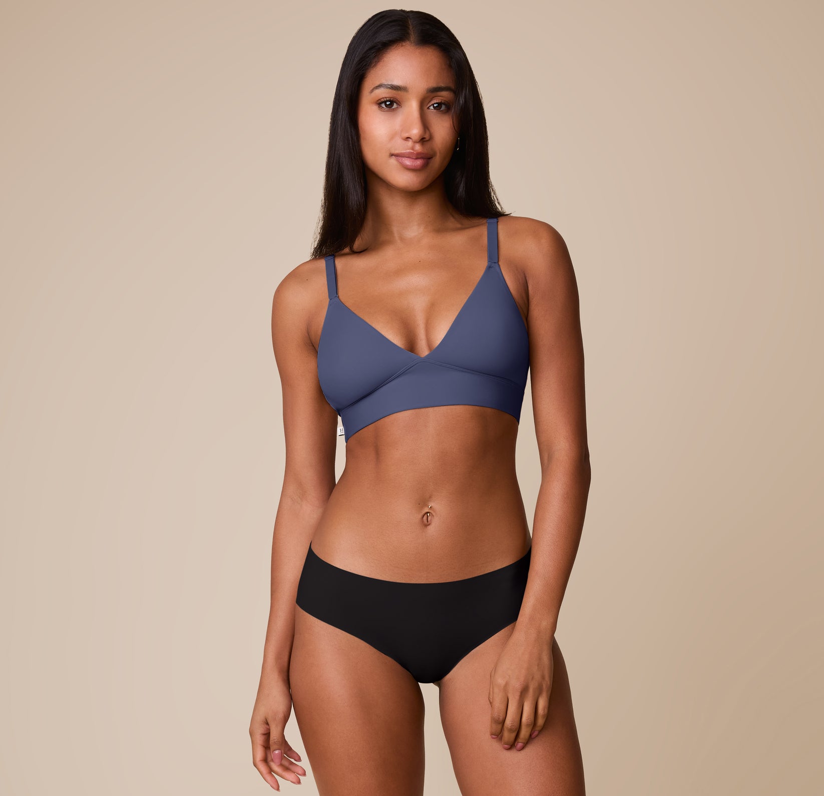 Full-body view of Ally modeling the Bliss Triangle Bralette in Twilight with the No Show Hiphugger in Black. The image shows the clean lines and everyday comfort of the bra’s design. 