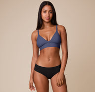 Full-body view of Ally modeling the Bliss Triangle Bralette in Twilight with the No Show Hiphugger in Black. The image shows the clean lines and everyday comfort of the bra’s design. 