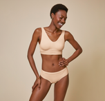 Woman wearing the bliss hiphugger in color beige